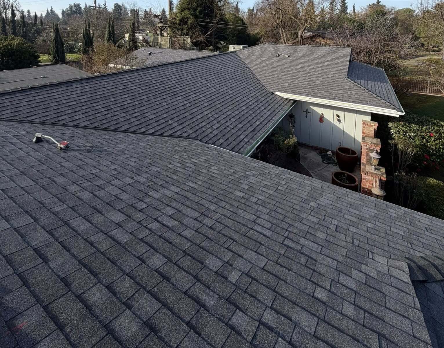 Completed shingle roof replacement on a Fresno home