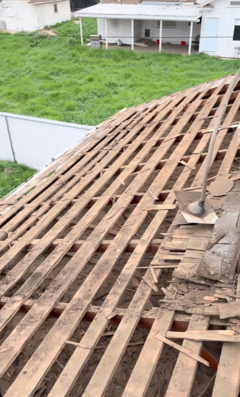 Tile roof tear-off exposing old underlayment